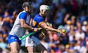 18 May 2025; Darragh McCarthy of Tipperary is tackled by Ian Kenny of Waterford during the Munster GAA Hurling Senior Championship Round 4 match between Tipperary and Waterford at FBD Semple Stadium in Thurles, Tipperary. Photo by Ray McManus/Sportsfile