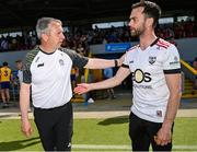 18 May 2025; Clare manager Peter Keane, left, and Down manager Conor Laverty after the GAA Football All-Ireland Senior Championship Round 1 match between Clare and Down at Zimmer Biomet Páirc Chíosóg in Ennis, Clare. Photo by Tom Beary/Sportsfile