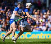 18 May 2025; Darragh McCarthy of Tipperary is tackled by Ian Kenny of Waterford during the Munster GAA Hurling Senior Championship Round 4 match between Tipperary and Waterford at FBD Semple Stadium in Thurles, Tipperary. Photo by Ray McManus/Sportsfile