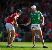 18 May 2025; Aaron Gillane of Limerick hands back a hurley to Eoin Downey of Cork after he was fouled resulring in a penalty for Limerick during the Munster GAA Hurling Senior Championship Round 4 match between Limerick and Cork at TUS Gaelic Grounds in Limerick. Photo by Brendan Moran/Sportsfile