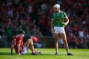 18 May 2025; Aaron Gillane of Limerick ends up with 2 hurleys after being fouled by Eoin Downey of Cork for a penalty during the Munster GAA Hurling Senior Championship Round 4 match between Limerick and Cork at TUS Gaelic Grounds in Limerick. Photo by Brendan Moran/Sportsfile