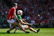 18 May 2025; Aaron Gillane of Limerick is fouled by Eoin Downey of Cork resulting in a penalty during the Munster GAA Hurling Senior Championship Round 4 match between Limerick and Cork at TUS Gaelic Grounds in Limerick. Photo by Brendan Moran/Sportsfile