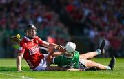 18 May 2025; Aaron Gillane of Limerick is fouled by Eoin Downey of Cork resulting in a penalty during the Munster GAA Hurling Senior Championship Round 4 match between Limerick and Cork at TUS Gaelic Grounds in Limerick. Photo by Brendan Moran/Sportsfile