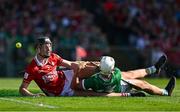 18 May 2025; Aaron Gillane of Limerick is fouled by Eoin Downey of Cork resulting in a penalty during the Munster GAA Hurling Senior Championship Round 4 match between Limerick and Cork at TUS Gaelic Grounds in Limerick. Photo by Brendan Moran/Sportsfile