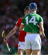 18 May 2025; Eoin Downey of Cork and Shane O'Brien of Limerick tussle during the Munster GAA Hurling Senior Championship Round 4 match between Limerick and Cork at TUS Gaelic Grounds in Limerick. Photo by Brendan Moran/Sportsfile