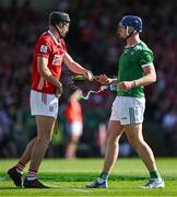 18 May 2025; Eoin Downey of Cork and Shane O'Brien of Limerick tussle during the Munster GAA Hurling Senior Championship Round 4 match between Limerick and Cork at TUS Gaelic Grounds in Limerick. Photo by Brendan Moran/Sportsfile