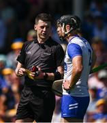 18 May 2025; Referee Sean Stack speaks to Ian Kenny of Waterford before issuing a yellow card during the Munster GAA Hurling Senior Championship Round 4 match between Tipperary and Waterford at FBD Semple Stadium in Thurles, Tipperary. Photo by Ray McManus/Sportsfile