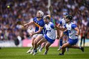 18 May 2025; Darragh McCarthy of Tipperary in action against Ian Kenny, 2, and Mark Fitzgerald of Waterford during the Munster GAA Hurling Senior Championship Round 4 match between Tipperary and Waterford at FBD Semple Stadium in Thurles, Tipperary. Photo by Ray McManus/Sportsfile