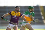 17 May 2025; Brian Duignan of Offaly in action against Conor Foley of Wexford during the Leinster GAA Hurling Senior Championship Round 4 match between Wexford and Offaly at Chadwicks Wexford Park in Wexford. Photo by Matt Browne/Sportsfile