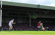 18 May 2025; Aaron Gillane of Limerick is fouled by Eoin Downey of Cork, resulting in a penalty for Limerick, during the Munster GAA Hurling Senior Championship Round 4 match between Limerick and Cork at TUS Gaelic Grounds in Limerick. Photo by Brendan Moran/Sportsfile