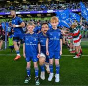 17 May 2025; Leinster captain Jack Conan with mascots Harry Dunne and Luca Finn O'Neill before the United Rugby Championship match between Leinster and Glasgow Warriors at the Aviva Stadium in Dublin. Photo by Ramsey Cardy/Sportsfile
