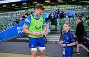 17 May 2025; Mascot Harry Dunne with Josh van der Flier before the United Rugby Championship match between Leinster and Glasgow Warriors at the Aviva Stadium in Dublin. Photo by Ramsey Cardy/Sportsfile