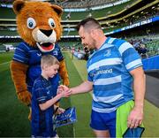 17 May 2025; Mascot Harry Dunne with Cian Healy before the United Rugby Championship match between Leinster and Glasgow Warriors at the Aviva Stadium in Dublin. Photo by Ramsey Cardy/Sportsfile