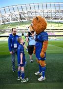 17 May 2025; Mascot Harry Dunne with Leo the Lion before the United Rugby Championship match between Leinster and Glasgow Warriors at the Aviva Stadium in Dublin. Photo by Ramsey Cardy/Sportsfile