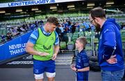 17 May 2025; Mascot Harry Dunne with Josh van der Flier before the United Rugby Championship match between Leinster and Glasgow Warriors at the Aviva Stadium in Dublin. Photo by Ramsey Cardy/Sportsfile