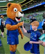 17 May 2025; Mascot Luca Finn O'Neill with Leo the Lion before the United Rugby Championship match between Leinster and Glasgow Warriors at the Aviva Stadium in Dublin. Photo by Ramsey Cardy/Sportsfile