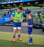 17 May 2025; Mascot Harry Dunne with Josh van der Flier before the United Rugby Championship match between Leinster and Glasgow Warriors at the Aviva Stadium in Dublin. Photo by Ramsey Cardy/Sportsfile