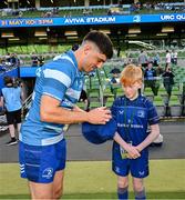 17 May 2025; Mascot Luca Finn O'Neill with Jimmy O'Brien before the United Rugby Championship match between Leinster and Glasgow Warriors at the Aviva Stadium in Dublin. Photo by Ramsey Cardy/Sportsfile