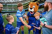 17 May 2025; Mascots Harry Dunne and Luca Finn O'Neill with Jordie Barrett before the United Rugby Championship match between Leinster and Glasgow Warriors at the Aviva Stadium in Dublin. Photo by Ramsey Cardy/Sportsfile