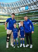 17 May 2025; Mascots Harry Dunne and Luca Finn O'Neill with Leinster players Brian Deeny and Jordan Larmour before the United Rugby Championship match between Leinster and Glasgow Warriors at the Aviva Stadium in Dublin. Photo by Ramsey Cardy/Sportsfile