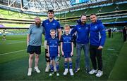 17 May 2025; Mascots Harry Dunne and Luca Finn O'Neill with Leinster players Brian Deeny and Jordan Larmour before the United Rugby Championship match between Leinster and Glasgow Warriors at the Aviva Stadium in Dublin. Photo by Ramsey Cardy/Sportsfile