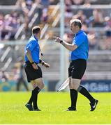 17 May 2025; Referee Thomas Gleeson, left, and linesman Johnny Murphy in discussion before Declan McCloskey of Antrim was sent off during the Leinster GAA Hurling Senior Championship Round 4 match between Galway and Antrim at Pearse Stadium in Galway. Photo by Piaras Ó Mídheach/Sportsfile