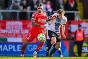 19 May 2025; Ellis Chapman of Shelbourne in action against Andrew Quinn of Drogheda United during the SSE Airtricity Men's Premier Division match between Shelbourne and Drogheda United at Tolka Park in Dublin. Photo by Sam Barnes/Sportsfile