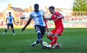 19 May 2025; Tyreke Wilson of Shelbourne is tackled by Elicha Ahui of Drogheda United during the SSE Airtricity Men's Premier Division match between Shelbourne and Drogheda United at Tolka Park in Dublin. Photo by Tyler Miller/Sportsfile
