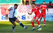 19 May 2025; James Norris of Shelbourne in action against Luke Heeney of Drogheda United during the SSE Airtricity Men's Premier Division match between Shelbourne and Drogheda United at Tolka Park in Dublin. Photo by Tyler Miller/Sportsfile