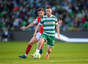 19 May 2025; Jack Byrne of Shamrock Rovers in action against Barry Baggley of St Patrick's Athletic during the SSE Airtricity Men's Premier Division match between Shamrock Rovers and St Patrick's Athletic at Tallaght Stadium in Dublin. Photo by Stephen McCarthy/Sportsfile