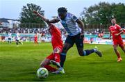 19 May 2025; Thomas Oluwa of Drogheda United is tackled by Evan Caffrey of Shelbourne during the SSE Airtricity Men's Premier Division match between Shelbourne and Drogheda United at Tolka Park in Dublin. Photo by Tyler Miller/Sportsfile