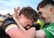19 May 2025; Offaly goalkeeper Jack Ryan, left, celebrates with a supporter after his side's victory in the Electric Ireland Leinster GAA Football Minor Championship final match between Offaly and Louth at Cedral St Conleth's Park in Newbridge, Kildare. Photo by Piaras Ó Mídheach/Sportsfile