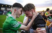 19 May 2025; Offaly goalkeeper Jack Ryan, right, celebrates with a supporter after his side's victory in the Electric Ireland Leinster GAA Football Minor Championship final match between Offaly and Louth at Cedral St Conleth's Park in Newbridge, Kildare. Photo by Piaras Ó Mídheach/Sportsfile