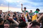 19 May 2025; Dermot Crombie of Offaly, 23, is held aloft by supporters after victory in the Electric Ireland Leinster GAA Football Minor Championship final match between Offaly and Louth at Cedral St Conleth's Park in Newbridge, Kildare. Photo by Piaras Ó Mídheach/Sportsfile