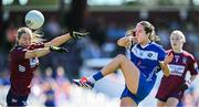 18 May 2025; Fiona Coyle of Westmeath blocks a kick by Laois' Mo Nerney during the TG4 Leinster LGFA Intermediate Championship final match between Laois and Westmeath at TEG Cusack Park in Mullingar, Westmeath. Photo by Seb Daly/Sportsfile