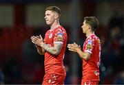 19 May 2025; Kameron Ledwidge of Shelbourne, left, and teammate Tyreke Wilson applaud the supporters after the SSE Airtricity Men's Premier Division match between Shelbourne and Drogheda United at Tolka Park in Dublin. Photo by Sam Barnes/Sportsfile