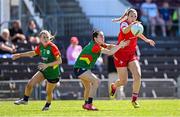 18 May 2025; Kate Flood of Louth in action against Katie Tunstead of Carlow during the TG4 Leinster LGFA Junior Championship final match between Carlow and Louth at TEG Cusack Park in Mullingar, Westmeath. Photo by Seb Daly/Sportsfile