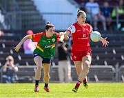 18 May 2025; Kate Flood of Louth in action against Katie Tunstead of Carlow during the TG4 Leinster LGFA Junior Championship final match between Carlow and Louth at TEG Cusack Park in Mullingar, Westmeath. Photo by Seb Daly/Sportsfile