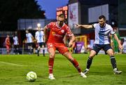 19 May 2025; Evan Caffrey of Shelbourne in action against Ryan Brennan of Drogheda United during the SSE Airtricity Men's Premier Division match between Shelbourne and Drogheda United at Tolka Park in Dublin. Photo by Sam Barnes/Sportsfile