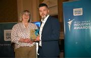 20 May 2025; Christopher Mulvaney presents an award to Dublin's FM104 Senior Senior News and Sports Journalist Hazel Nolan during the Irish Sport Industry Awards 2025 at College Green Hotel in Dublin. Photo by David Fitzgerald/Sportsfile