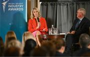 20 May 2025; Senator Evanne Ní Chuilinn in conversation with MC Sean O'Rourke during the Irish Sport Industry Awards 2025 at College Green Hotel in Dublin. Photo by David Fitzgerald/Sportsfile