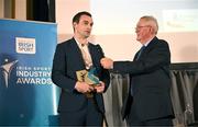 20 May 2025; Athletics Ireland Marketing and Communications Manager Darragh Brown, left, is presented with the Best Commerical Partnership in Sport award by Dublin City sport and wellbeing partnership manager Colin Sharkey during the Irish Sport Industry Awards 2025 at College Green Hotel in Dublin. Photo by David Fitzgerald/Sportsfile  Photo by David Fitzgerald/Sportsfile *** NO REPRODUCTION FEE ***