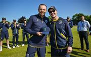 21 May 2025; Liam McCarthy of Ireland, left, is presented with his international debut cap by teammate Curtis Campher ahead of the first match of the One Day International Series between Ireland and the West Indies at Clontarf Cricket Club in Dublin. Photo by Sam Barnes/Sportsfile