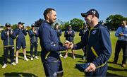 21 May 2025; Liam McCarthy of Ireland, left, is presented with his international debut cap by teammate Curtis Campher ahead of the first match of the One Day International Series between Ireland and the West Indies at Clontarf Cricket Club in Dublin. Photo by Sam Barnes/Sportsfile