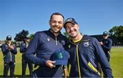 21 May 2025; Liam McCarthy of Ireland, left, is presented with his international debut cap by teammate Curtis Campher ahead of the first match of the One Day International Series between Ireland and the West Indies at Clontarf Cricket Club in Dublin. Photo by Sam Barnes/Sportsfile