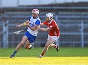 16 May 2025; Cormac Spain of Waterford in action against Bobby Carroll of Cork during the Electric Ireland GAA Hurling Munster Minor Championship final match between Cork and Waterford at FBD Semple Stadium in Thurles, Tipperary. Photo by Piaras Ó Mídheach/Sportsfile