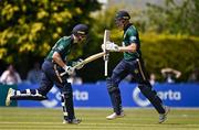21 May 2025; Ireland batter Andrew Balbirnie, left, runs a single with teammate Harry Tector, right, to bring up century during the first match of the One Day International Series between Ireland and the West Indies at Clontarf Cricket Club in Dublin. Photo by Sam Barnes/Sportsfile