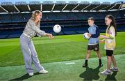 21 May 2025; In attendance at the GAA Cúl Camps Partnership with the Department of Education and Youth and the Tusla Education Support Services (TESS) Announcement at Croke Park in Dublin are, from left, Minister for Education and Youth Helen McEntee TD, with pupils from O'Connell's Primary School Leroy Ward and Dezara Grouse. Photo by Seb Daly/Sportsfile