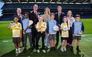21 May 2025; In attendance at the GAA Cúl Camps Partnership with the Department of Education and Youth and the Tusla Education Support Services (TESS) Announcement at Croke Park in Dublin are, back row from left, Games Development Committee Chairperson Micheál Martin, Uachtarán Chumann Lúthchleas Gael Jarlath Burns, Minister for Education and Youth Helen McEntee TD, GAA Director of Games Development Shane Flanagan, and Tusla Education Support Service Director Áine O'Keeffe, with pupils from O'Connell's Primary School, front row from left, Isaiah Ogorro, Ayub Ali, Kaydi Rae Shannon, Ivan Egan, Dezara Grouse and Leroy Ward. Photo by Seb Daly/Sportsfile
