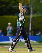21 May 2025; Ireland batter Harry Tector celebrates bringing up his half century during the first match of the One Day International Series between Ireland and the West Indies at Clontarf Cricket Club in Dublin. Photo by Sam Barnes/Sportsfile